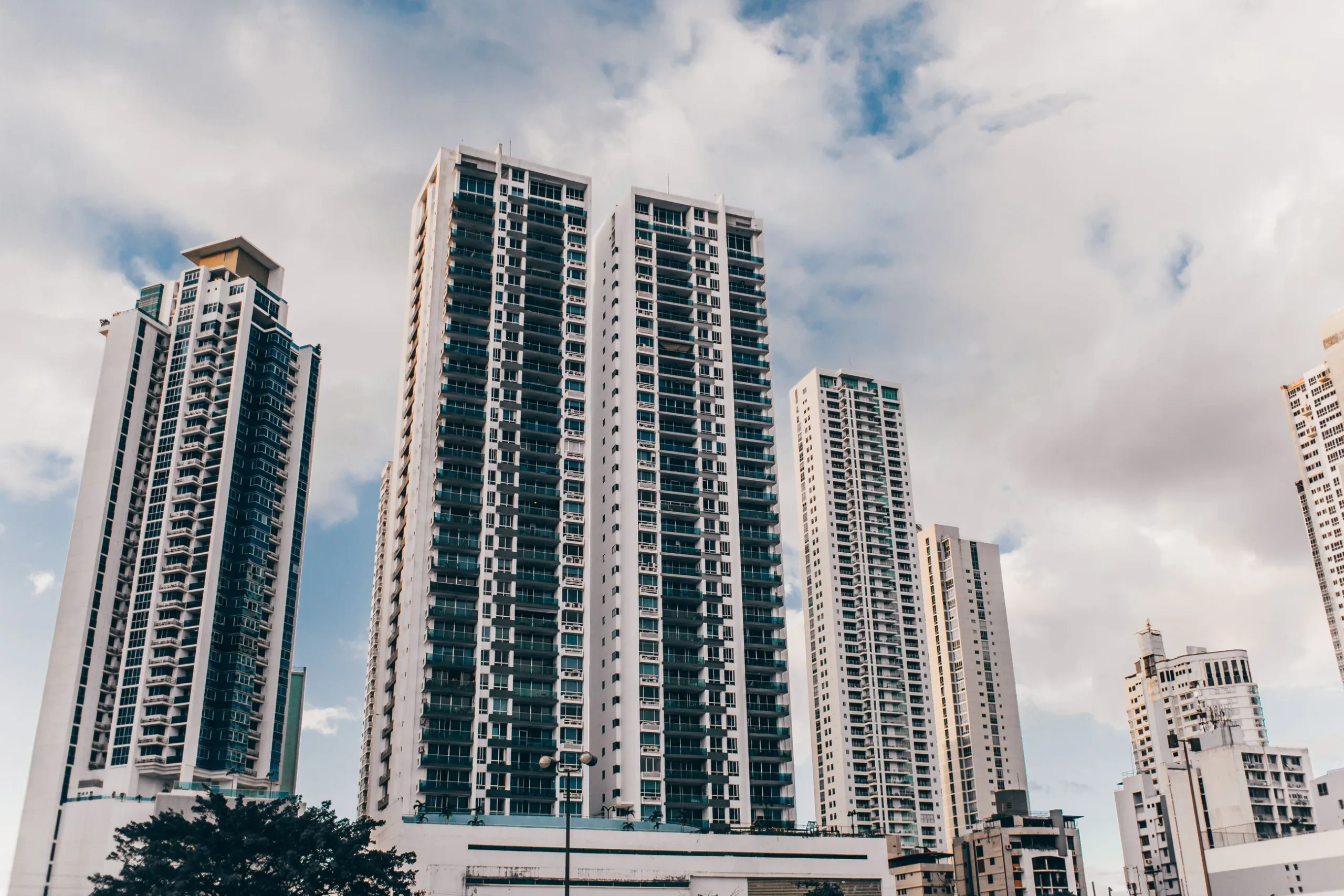 Modern residential towers against a blue sky